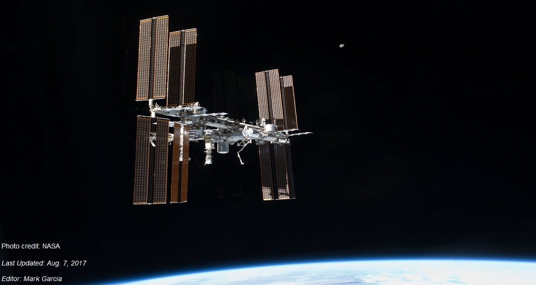 The International Space Station is pictured as space shuttle Atlantis approached the complex in 2011. The Space Stations massive solar arrays dwarf the surrounding structures and provide power for all the research that takes place on the station.